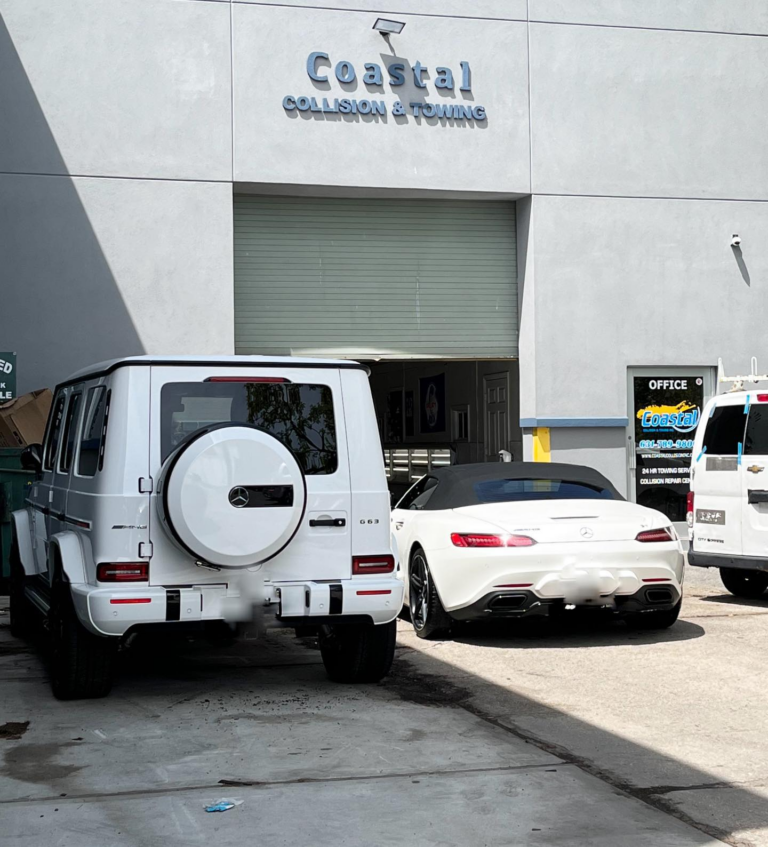 vehicles parked in front of a building with a sign that says costal