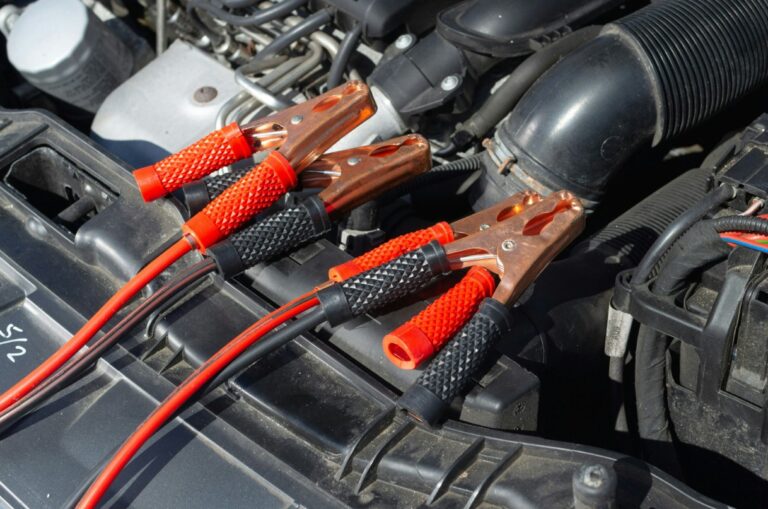 there are two jumpers connected to a car battery with wires